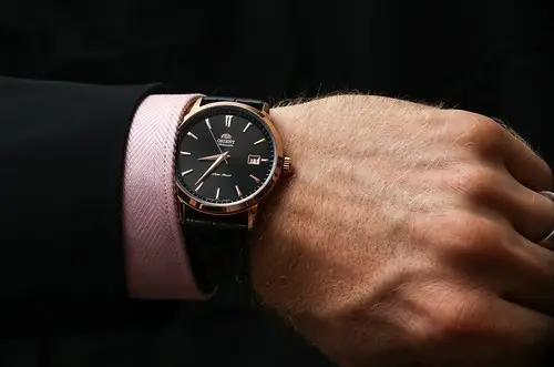 black luxury watch on man's wrist