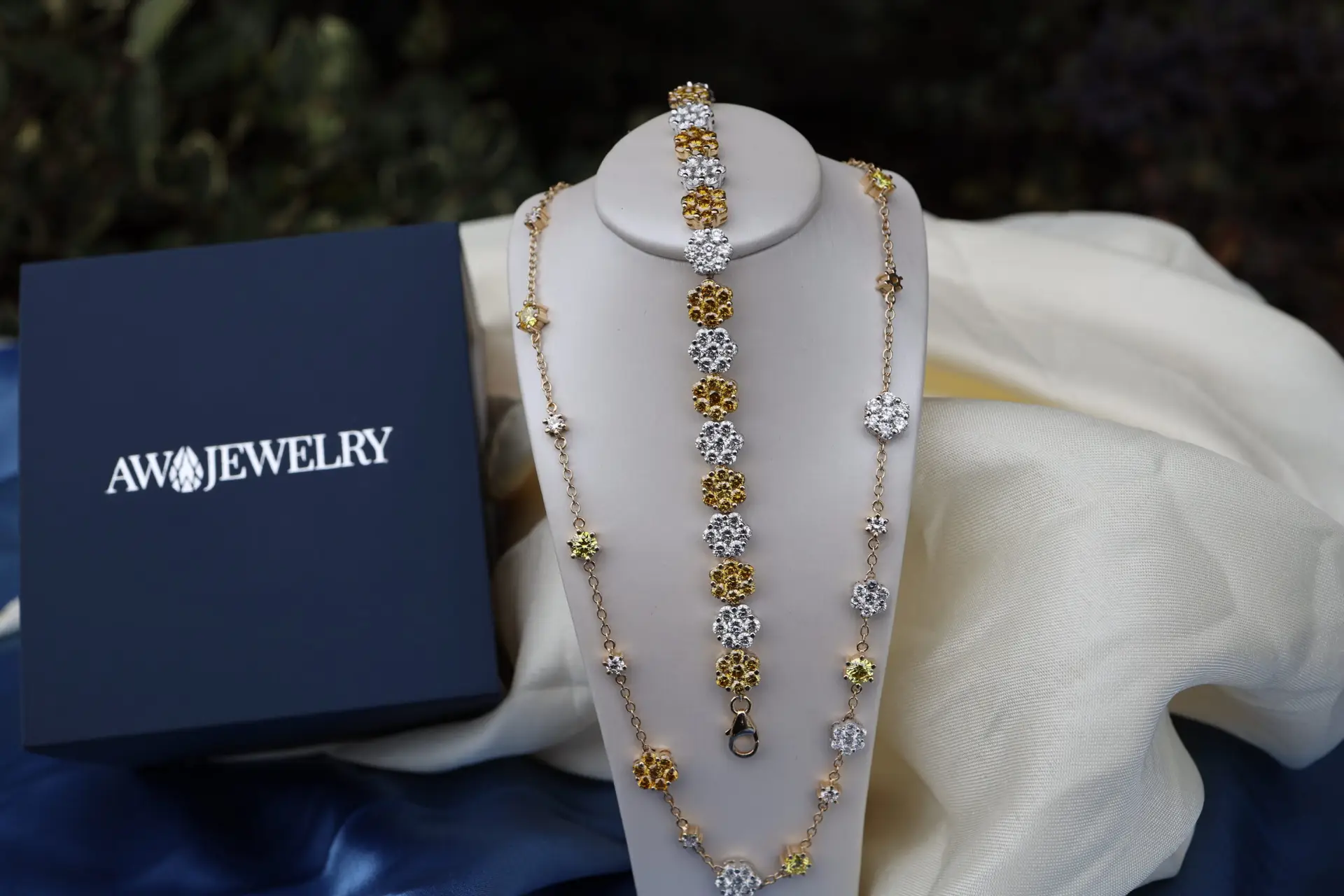 custom matching diamond necklace and bracelet in yellow gold and white gold