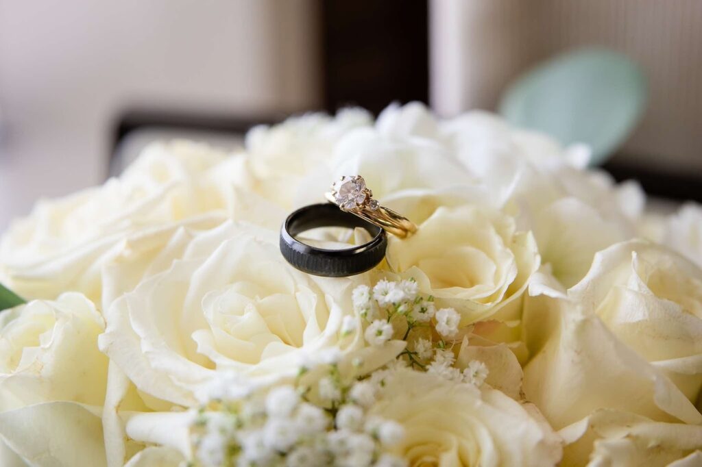 Elegant contrast wedding bands on blooms