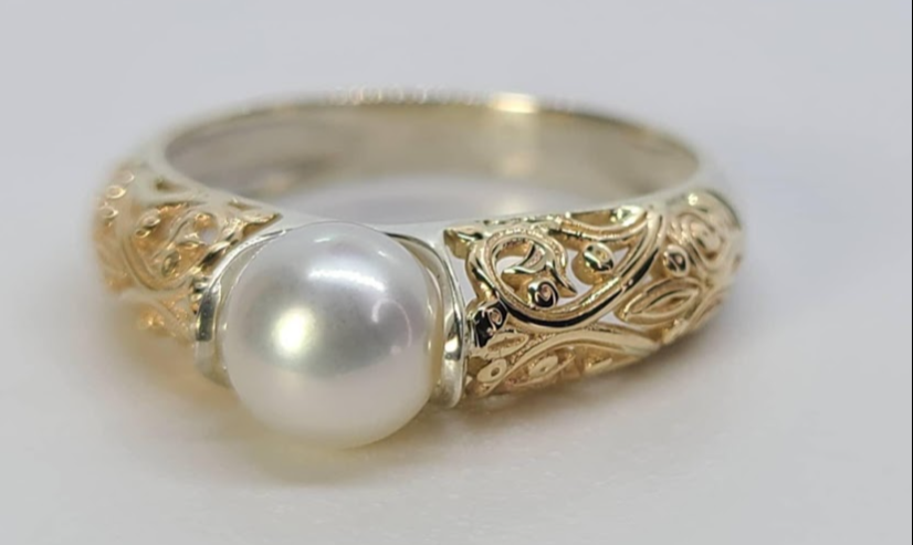 Halo setting for graceful finger coverage.
